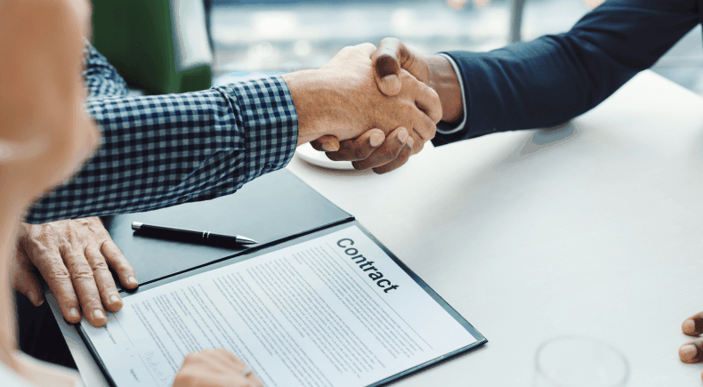 Business owners reviewing a funding agreement