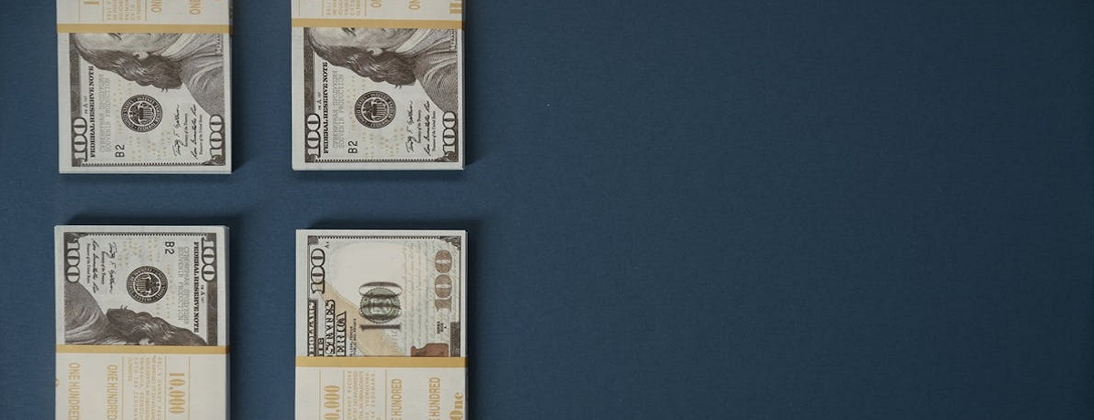 Four bundles of 100 dollar bills set aside for working capital loans to fund business cash flows