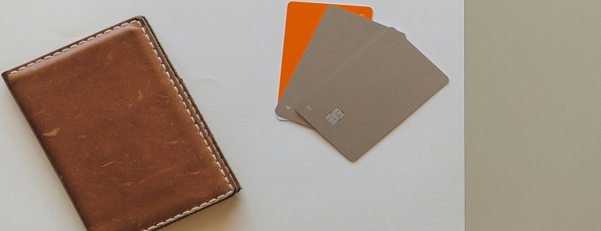 Wallet with credit card obtained through low interest business loans.